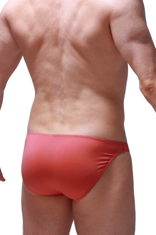 Bikini dome blush red form-fitting swim trunks with smooth stretchy fabric and subtle gradient finish