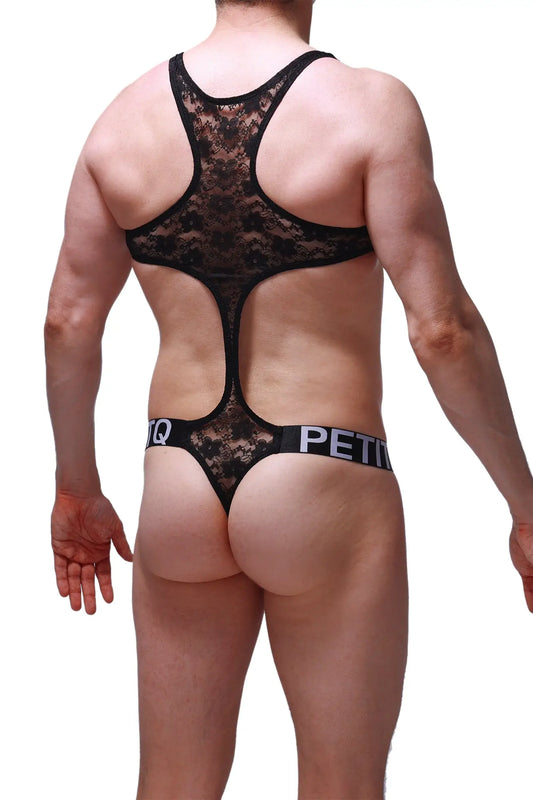 Back side of a black lace bodythong oze lace with a cutout back and petitq branded waistband