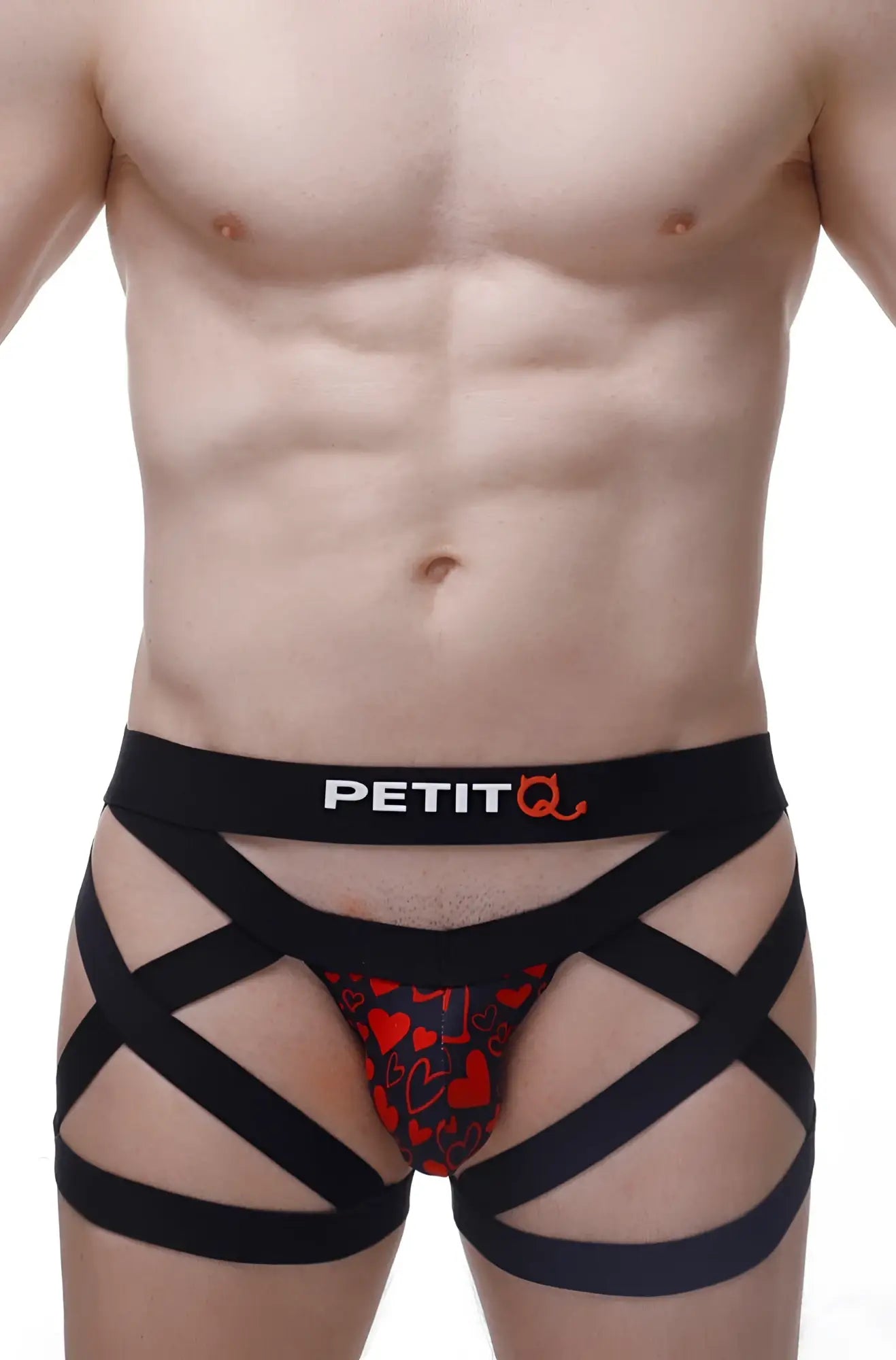 Black strappy men’s boxer brief with red heart pattern and petitq logo on waistband king of hearts design