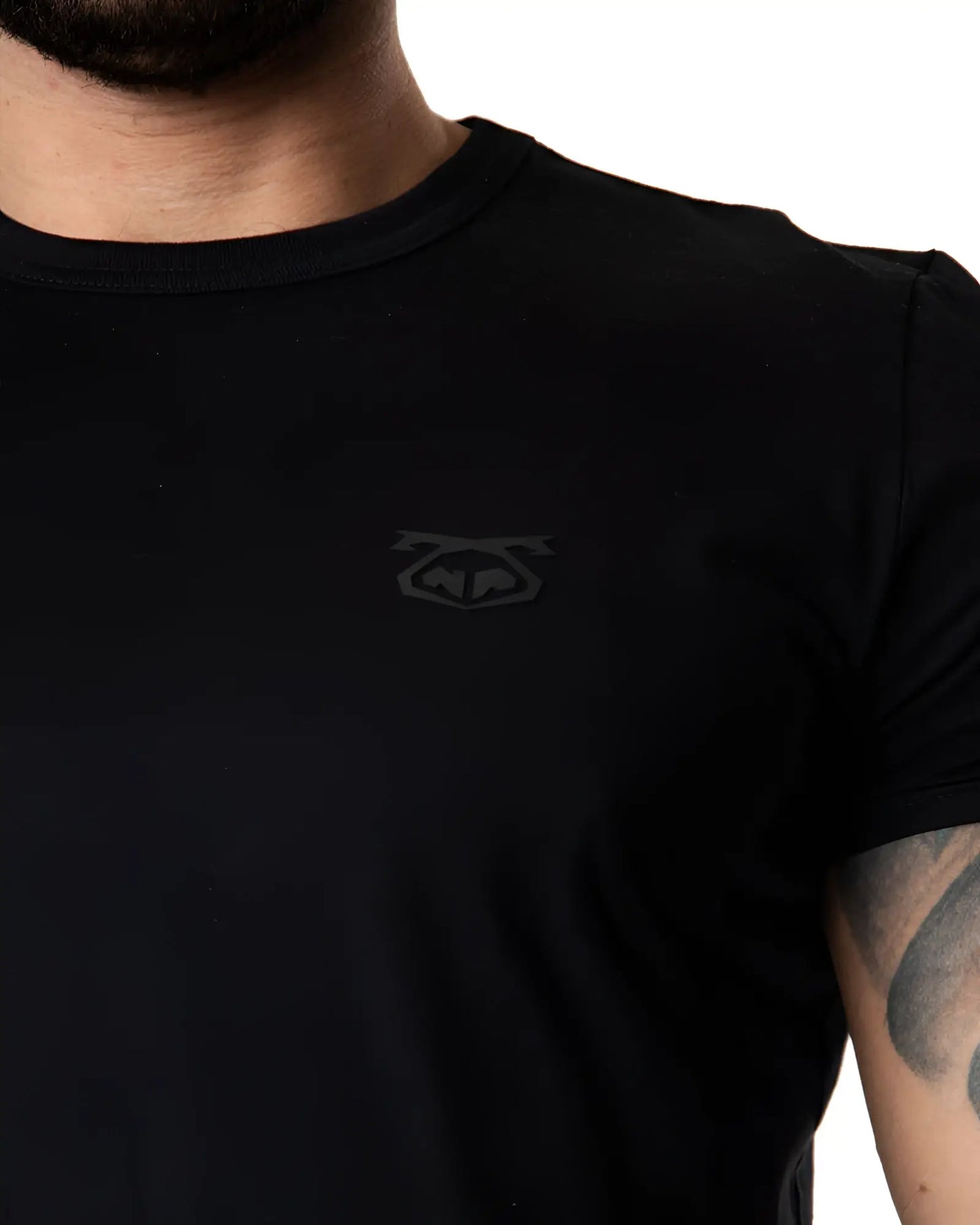 Black crew-neck brandmark tee with subtle dark gray logo on left chest made of soft cotton material