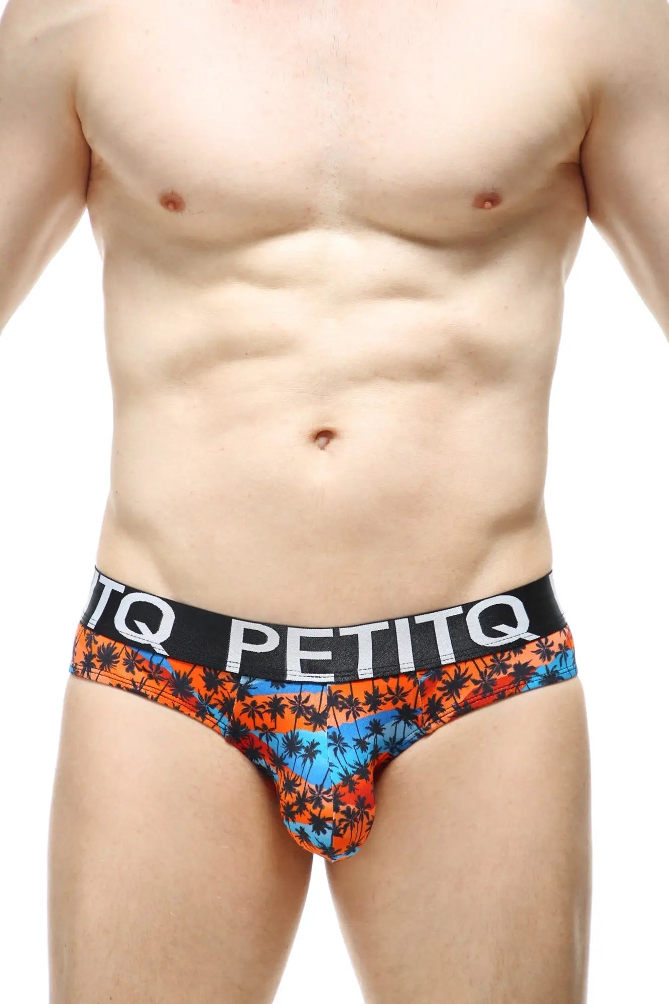 Vibrant tropical print briefs in orange blue and black with bold petitq logo on waistband brief protruder tema e