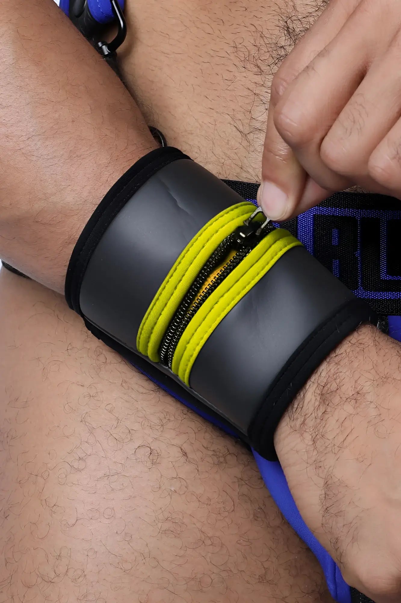 Black buckle up cuff wristband with bright yellow zipper accents available in 5 colors