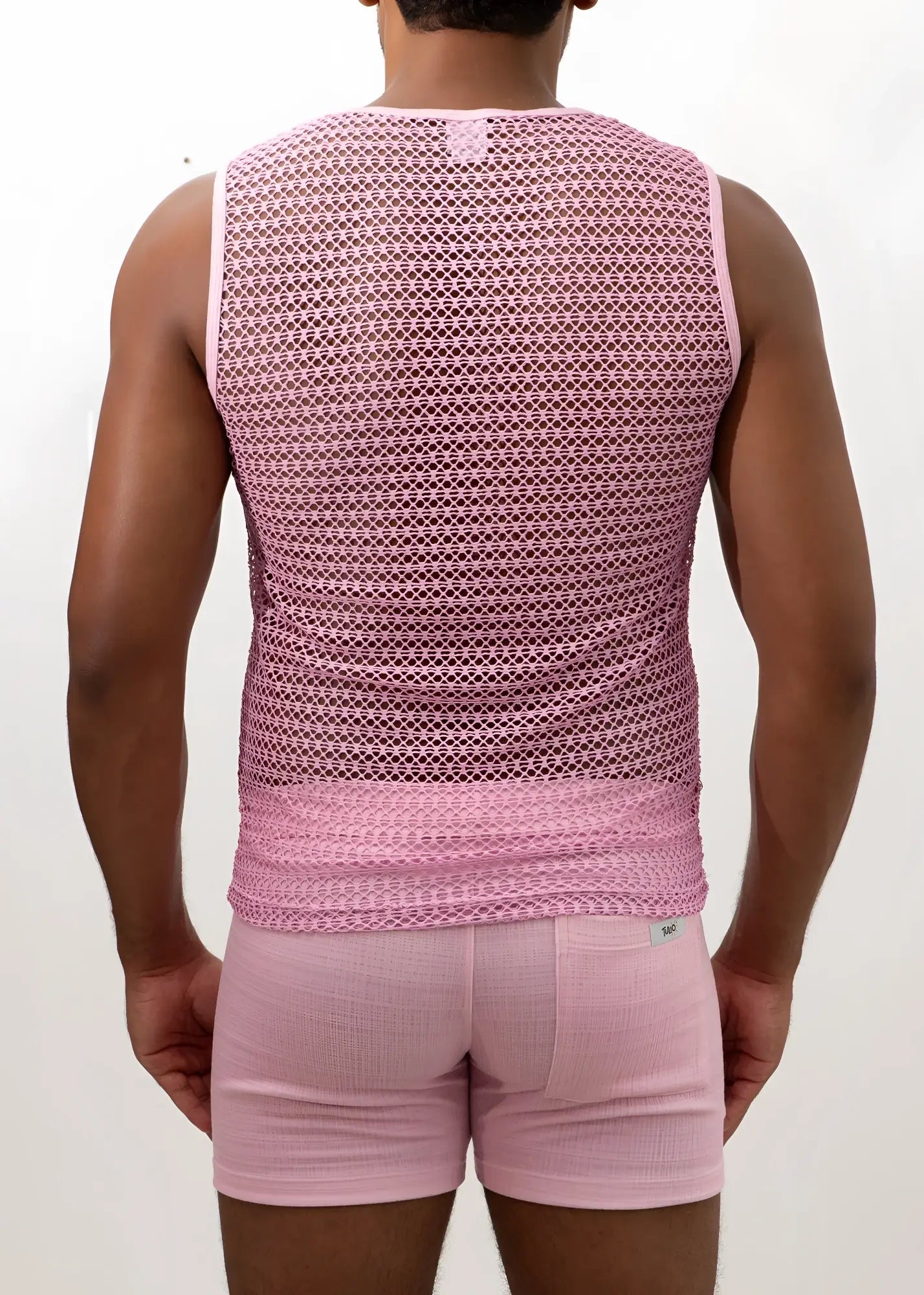 Pink crochet muscle tank top with mesh fabric subtle geometric pattern and ribbed hem for casual wear