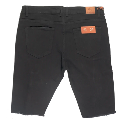 Back view of crysp denim cut off short black slim fit denim shorts with two back pockets and orange brand tags