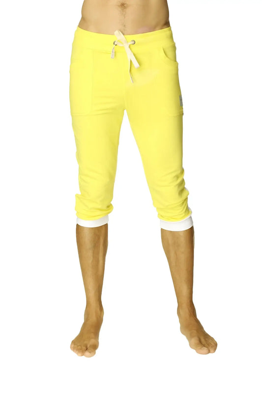 Cuffed yoga pants in tropic yellow with white drawstring and contrasting cuffs made from soft breathable fabric