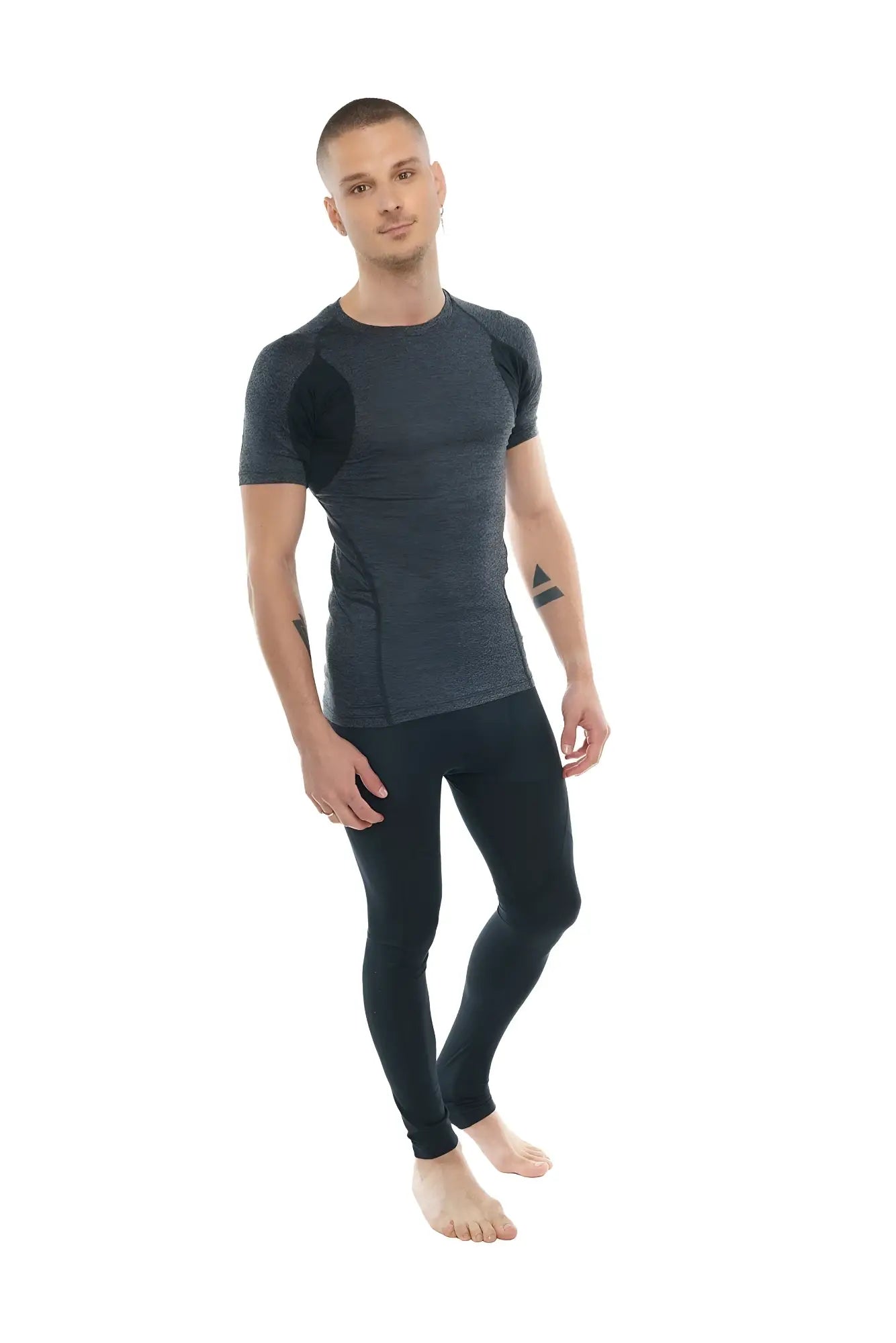 Dark gray and black designer raglan crew-neck tee with textured panels paired with form-fitting athletic leggings
