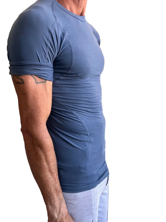 Designer raglan crew-neck tee in denim blue features a fitted short sleeve athletic design with subtle seam details and rolled sleeves