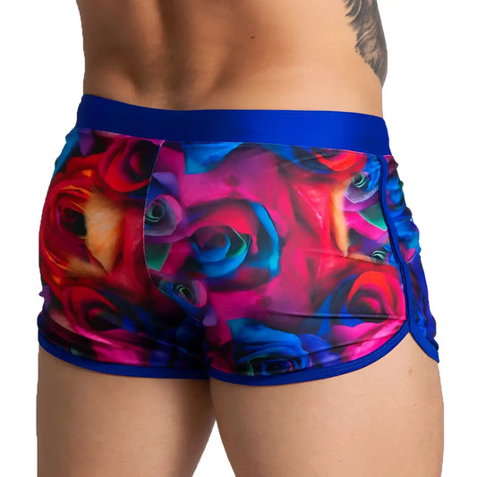 Gigo carnations beachwear vibrant multicolored rose-patterned men’s shorts with bold blue elastic waistband and trim
