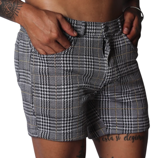 Men's slim-fit shorts in a black and white houndstooth glen plaid pattern with subtle gold thread accents.