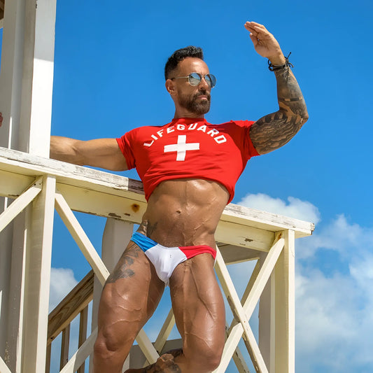 Red lifeguard t-shirt with white cross emblem from good devil gdi025 brief for beach or pool use