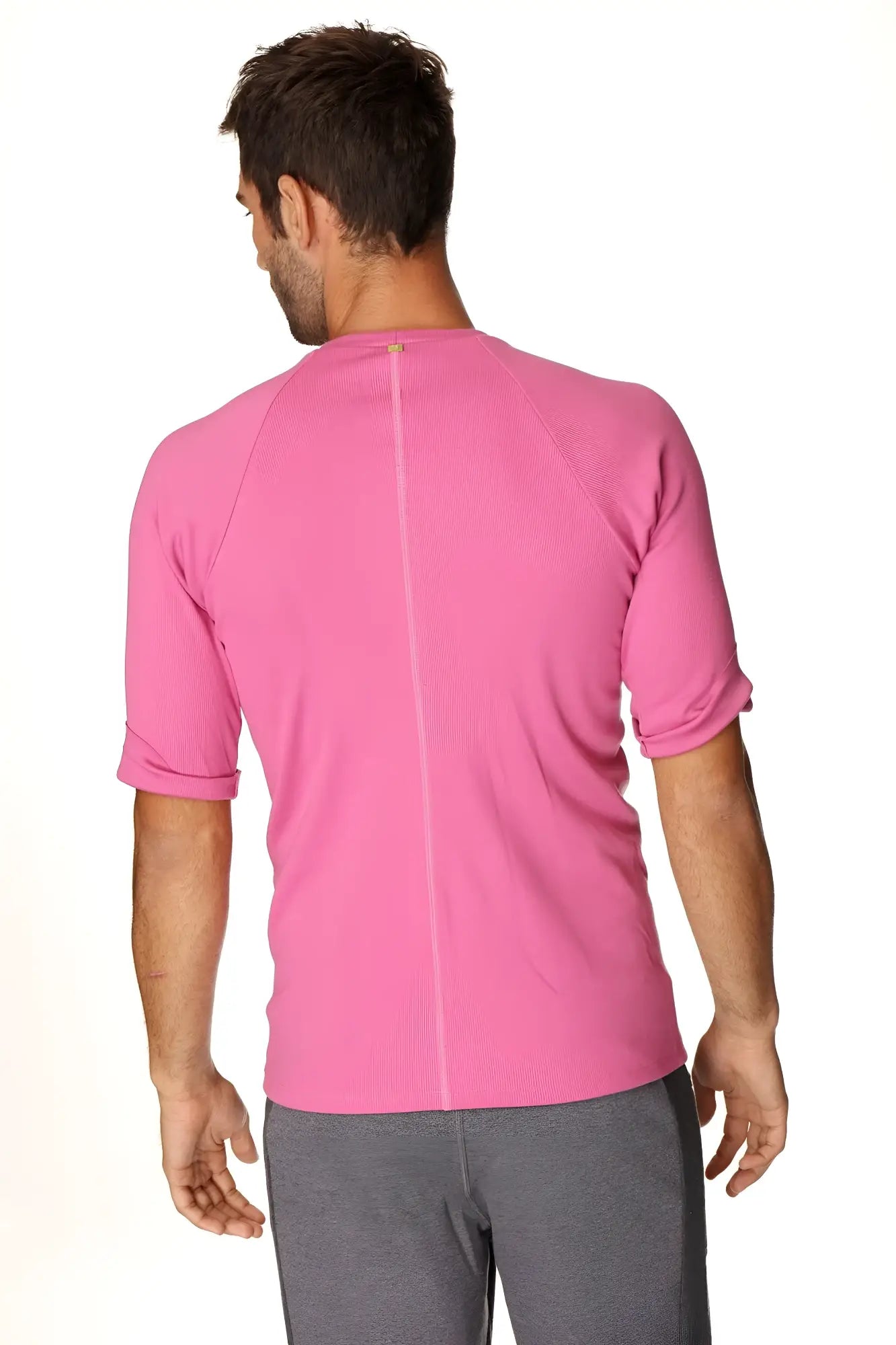 A vibrant pink hybrid crew neck raglan tee with textured fabric and short sleeves for athletic wear
