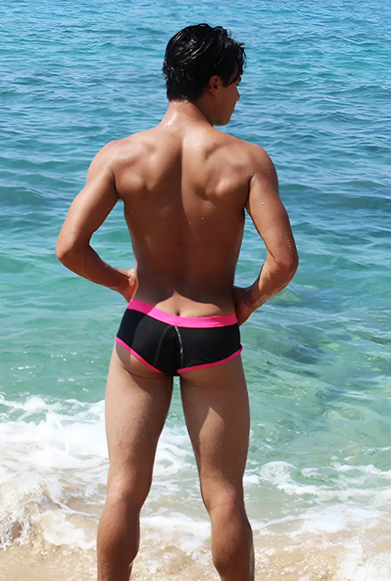 Black swim trunks with bright pink contrast trim and stitching from icker sea cheeky bikini swimwear collection