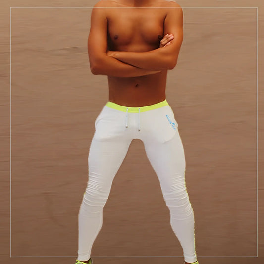 White icker sea side stripe runner pants with neon yellow waistband and blue logo on thigh athletic leggings