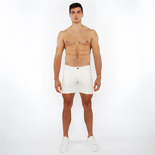 White jaquard stretch knit chino shorts with a sleek minimalist design and a black button at the waistband