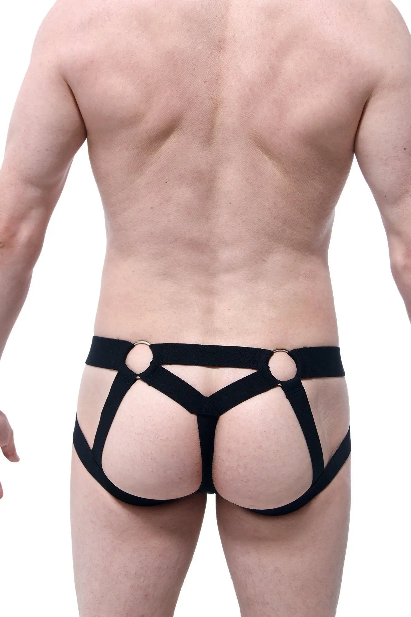 Black harness-style jockstring briefs with gold-toned metal rings at the waistband front view