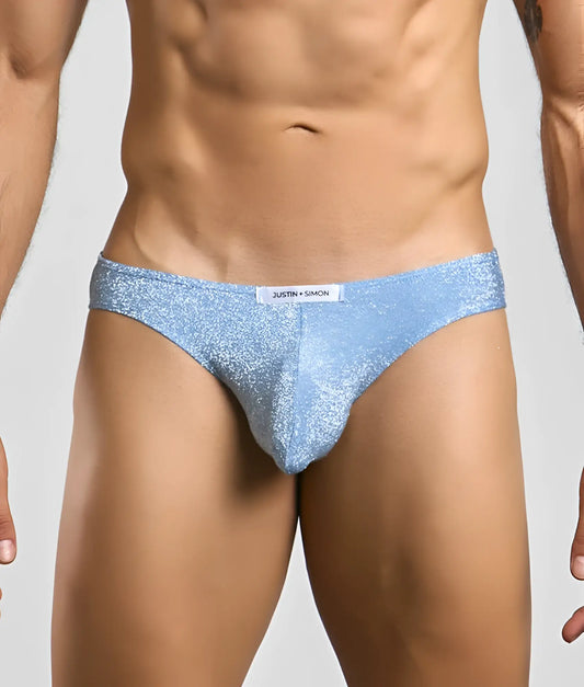 Light blue glittery men’s briefs with white justin + simon brand tag from the Justin + Simon classic mens bikini line
