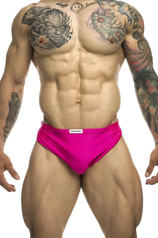 Bright pink form-fitting justin simon xsj09 running briefs with white brand tag at waistband for active use