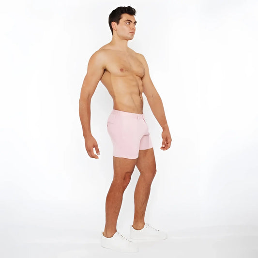 Pink linen-look textured athletic shorts with zip pockets and minimalist design