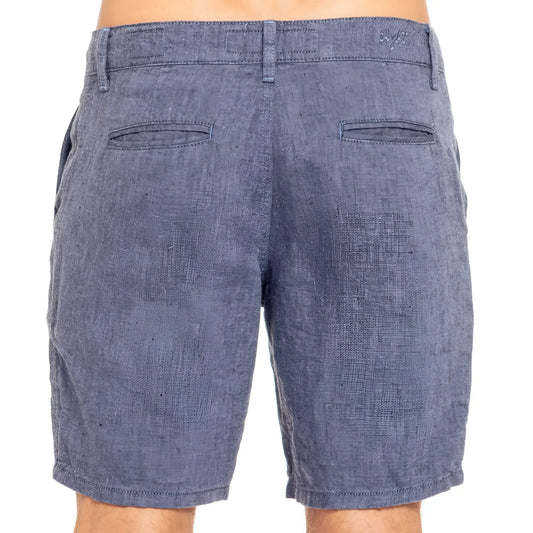Blue linen slim fit shorts in denim with textured weave and two back pockets shown from the back side