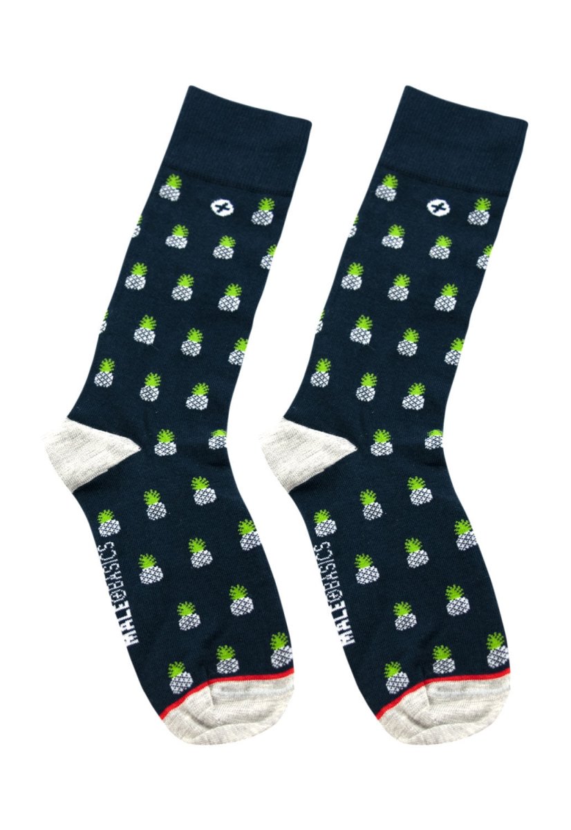 Navy blue male basics fun socks with green and white pineapple pattern and red toe and heel trim