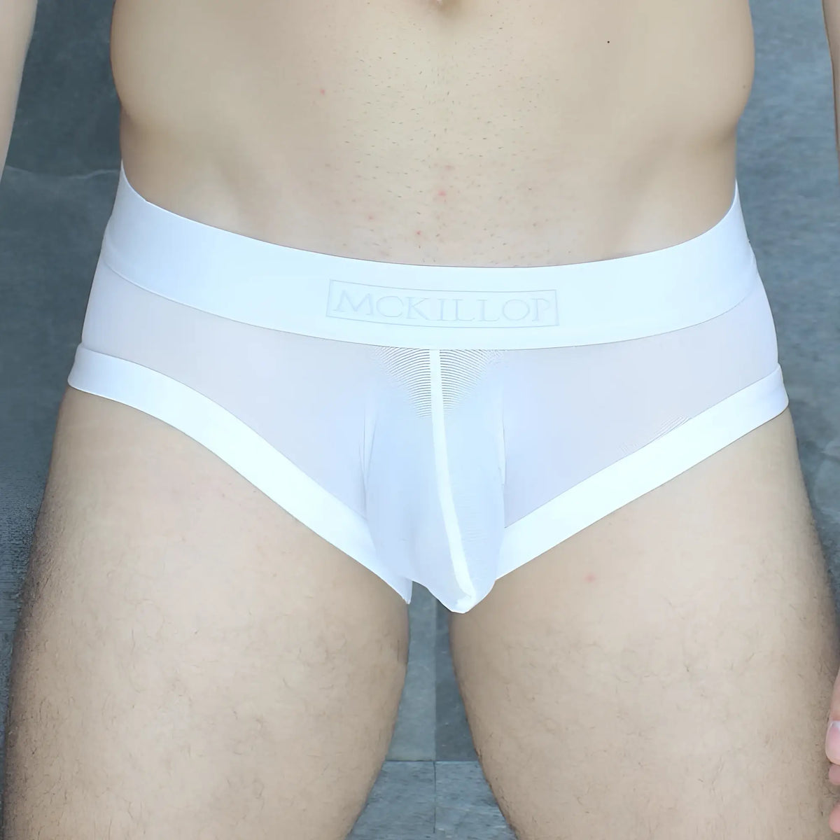 White mesh mckillop obus hoist brief ultra mesh with solid white waistband featuring mckillor brand name