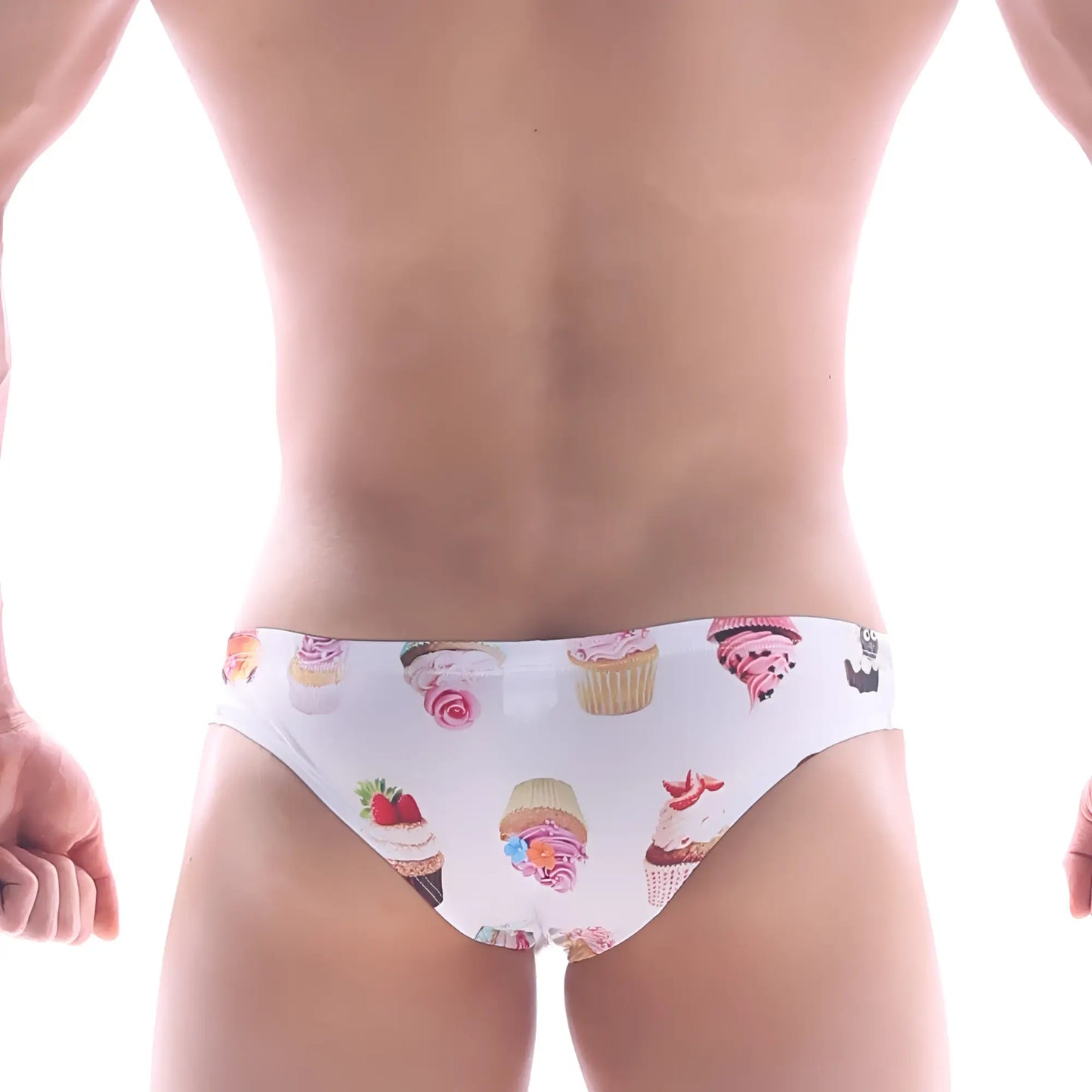 White MetroMaleWear Capri bikini swim trunks with colorful cupcake and frosting pattern for playful beachwear