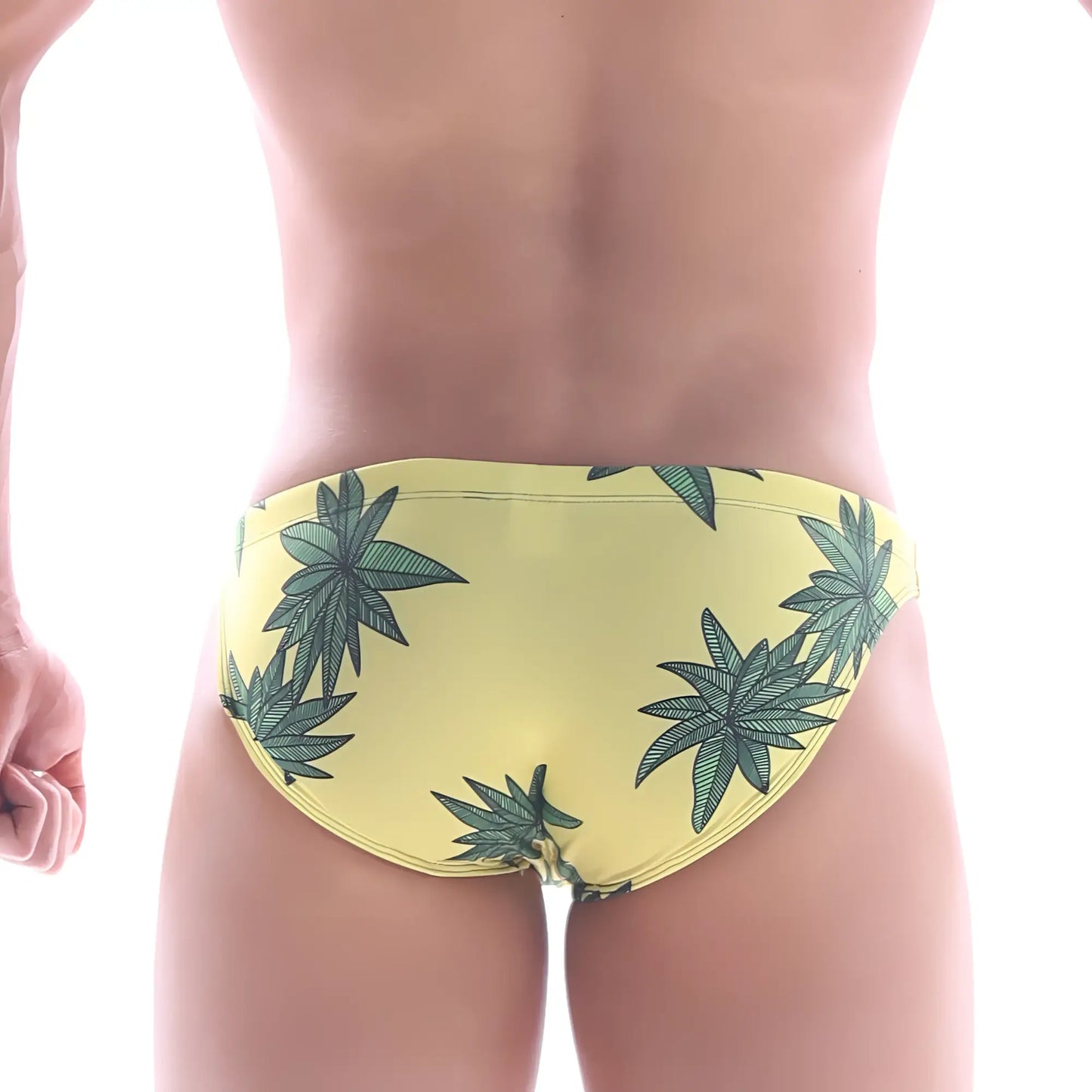 Yellow swim bikini by MetroMaleWear featuring a repeating green cannabis leaf pattern for classic beachwear