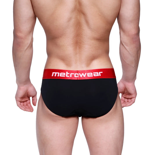 Black briefs with a red waistband featuring the metrowear logo in white from metro malewear downhole brief 3029-20
