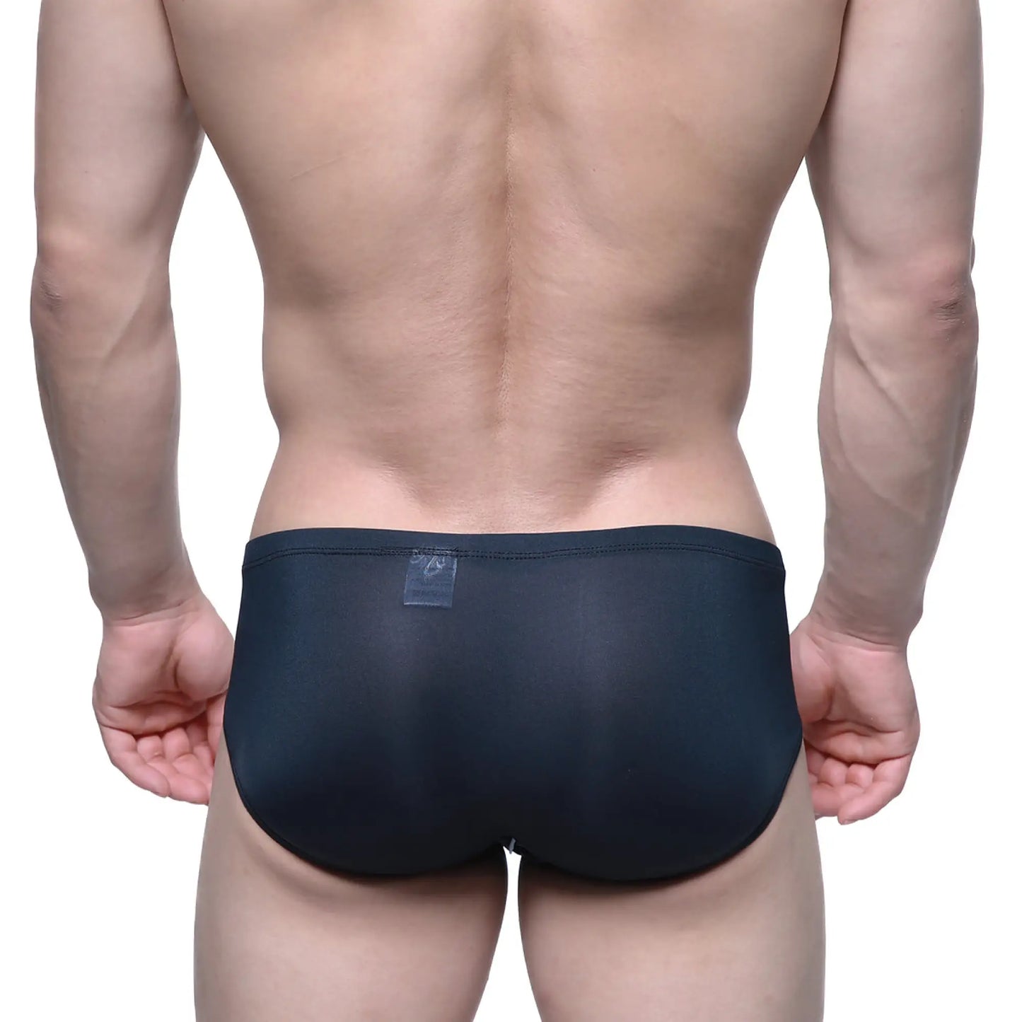 Black form-fitting swim trunks by MetroMaleWear Entropy Bikini 1006-21 with smooth stretchy fabric and transparent waistband label
