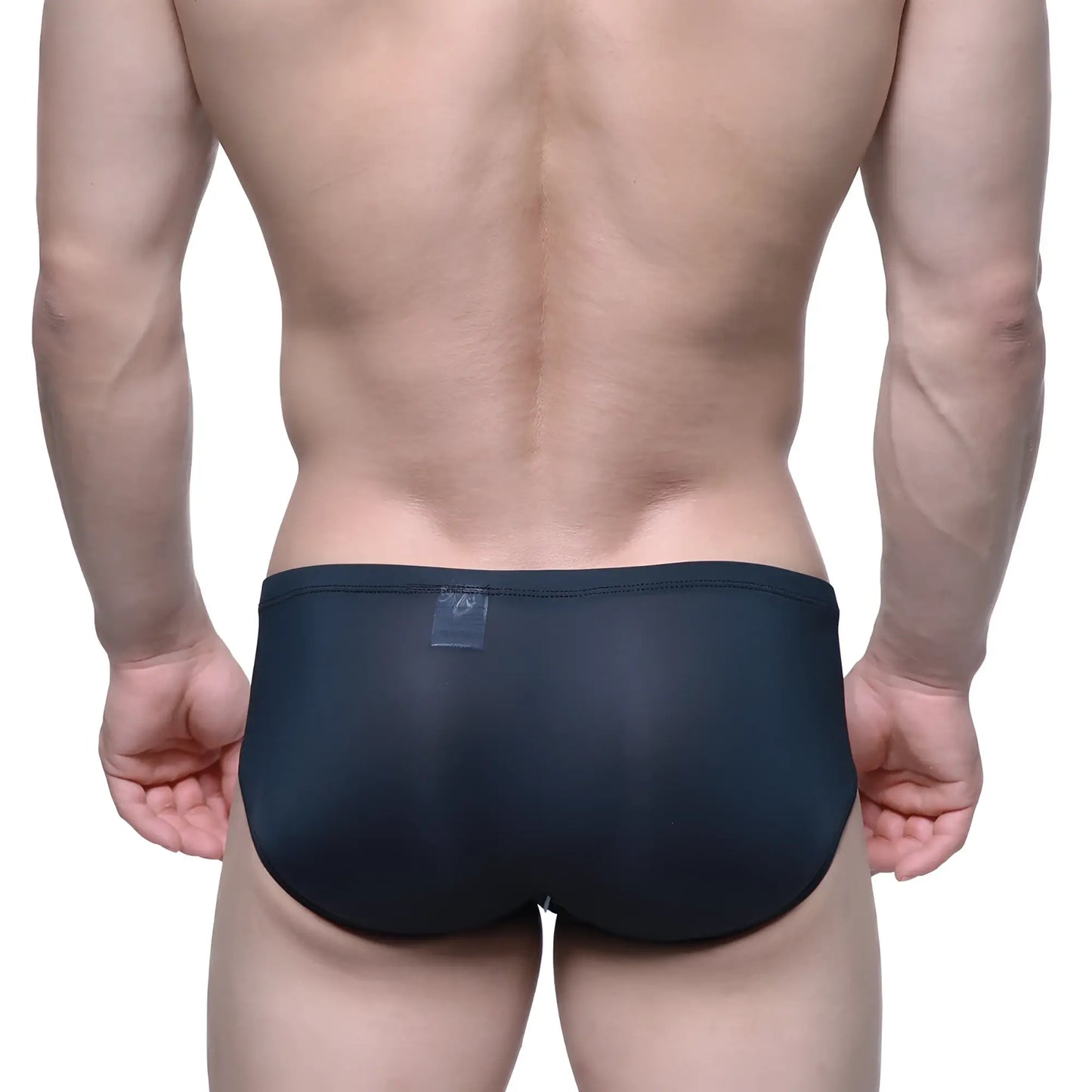 Black form-fitting swim trunks by MetroMaleWear Entropy Bikini 1006-21 with smooth stretchy fabric and transparent waistband label