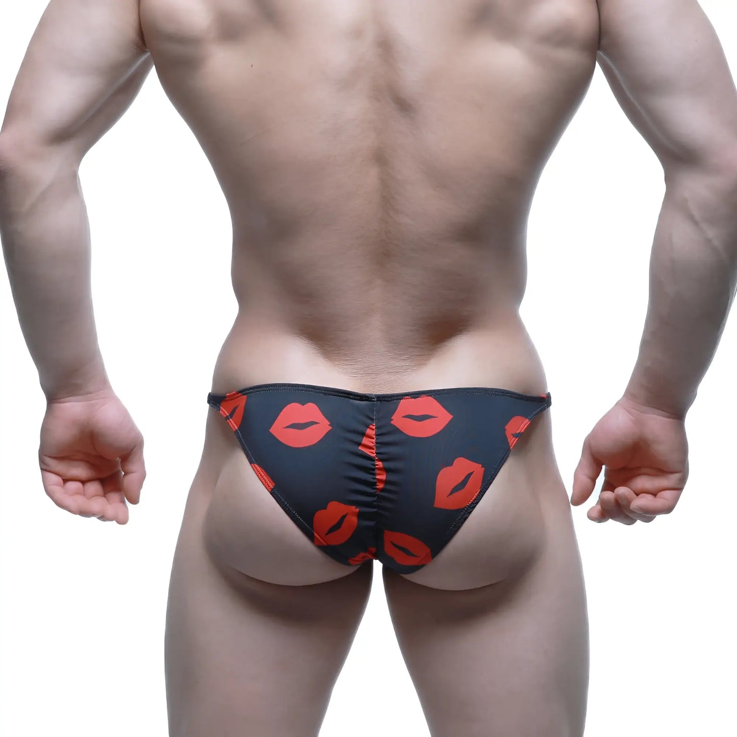 Black MetroMaleWear Fantasy Bikini Kiss 6116-62 swim trunks with bold red lipstick print pattern