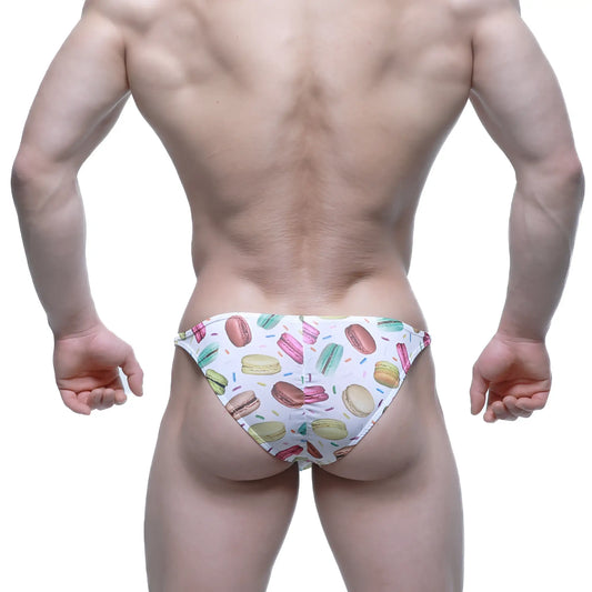 White swim trunks by MetroMaleWear featuring a colorful macaron and sprinkle pattern for playful beachwear