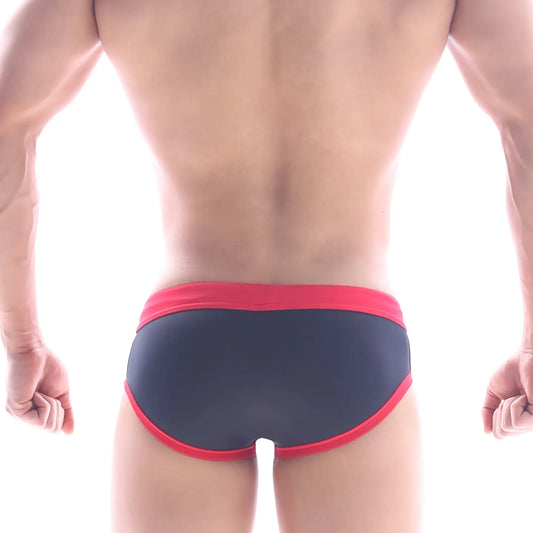 Dark blue metro male wear frame swim brief with bold red trim on waistband and leg openings for swimming