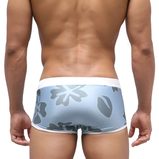 Light blue MetroMaleWear Fresco swim trunk briefs with gray floral pattern and white trim for natural comfort