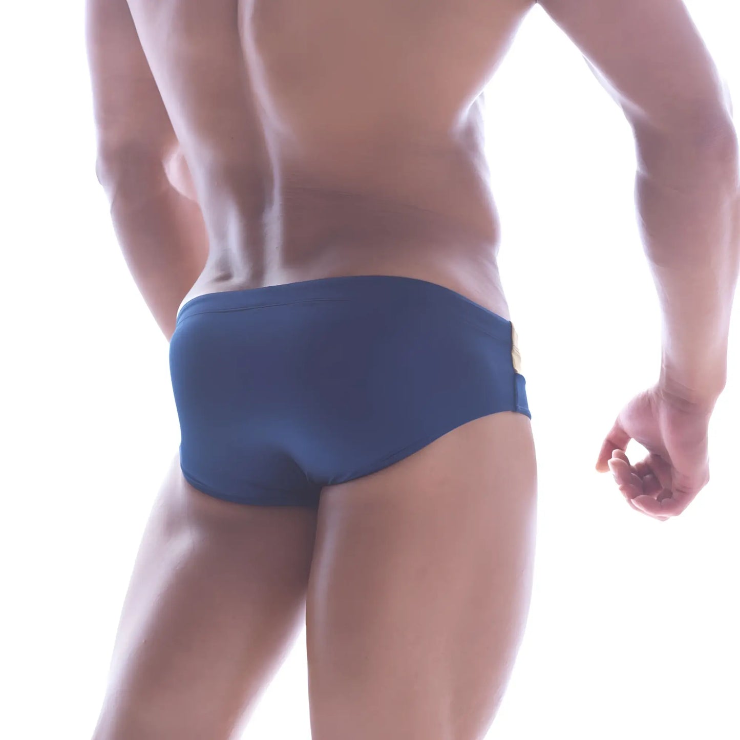 Navy blue MetroMaleWear Ibiza swim brief with gold metallic side seam accent ideal for stylish beachwear