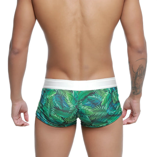 Green tropical leaf-patterned swim trunks with white elastic waistband by MetroMaleWear jungle trunk 2026-08