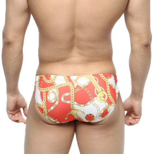 MetroMaleWear Lujo bikini red swim trunks with bold gold chain and anchor pattern for stylish beachwear