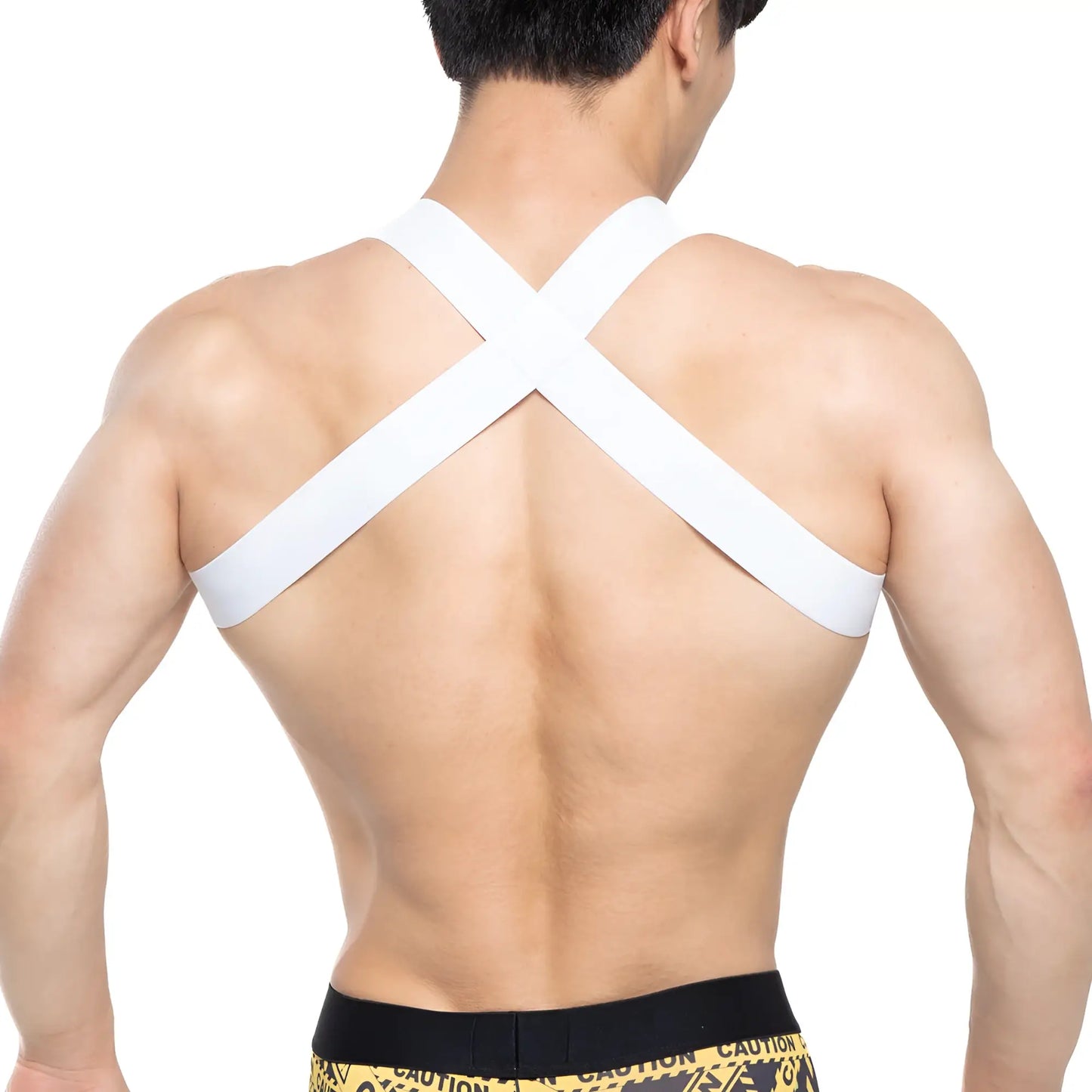 White cross-back athletic support strap worn over the shoulders showing the back side of metromalewear danger harness 1400-63