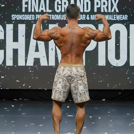 A pair of beige and brown snake-print MetroMaleWear MetroMuscleWear honeycomb physique board shorts with tan waistband