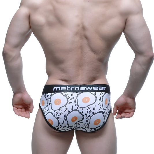 White briefs with a playful fried egg pattern and a branded metroewear waistband.