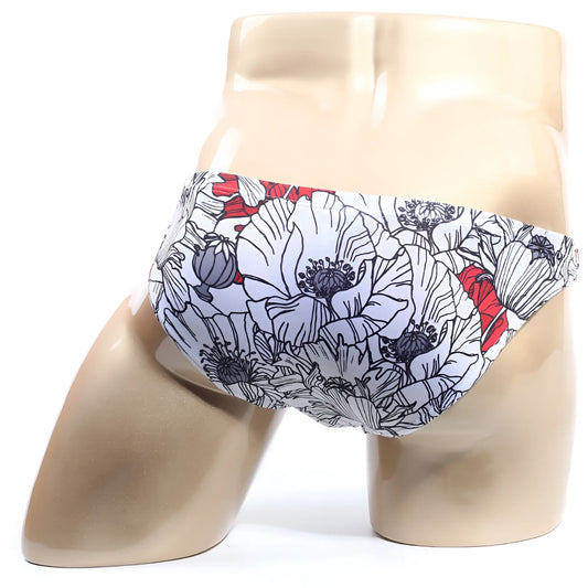 White swim trunks with bold floral pattern black outlines and red accents from metromalewear vendeta bikini blossom 2614-09