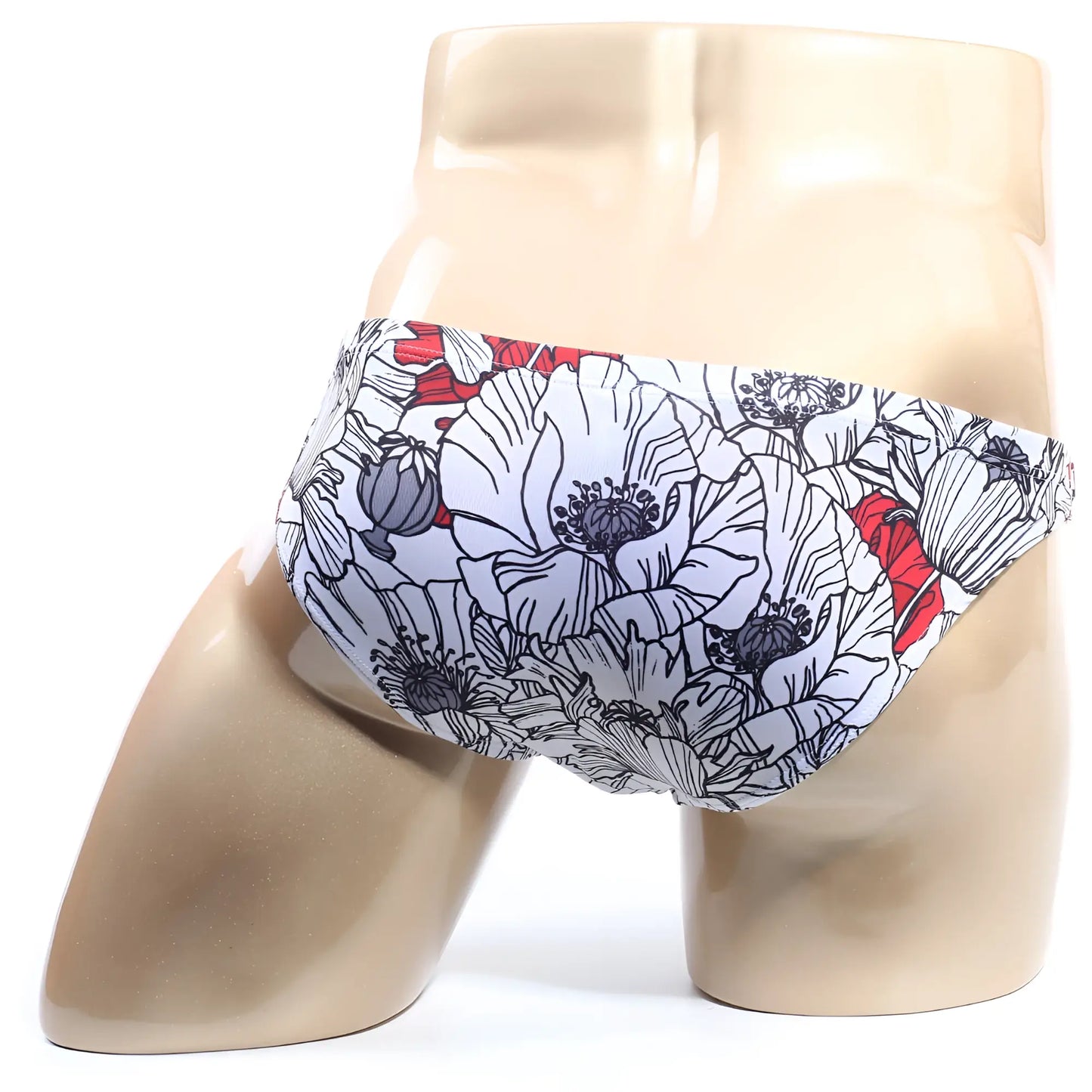 White swim trunks with bold floral pattern black outlines and red accents from metromalewear vendeta bikini blossom 2614-09