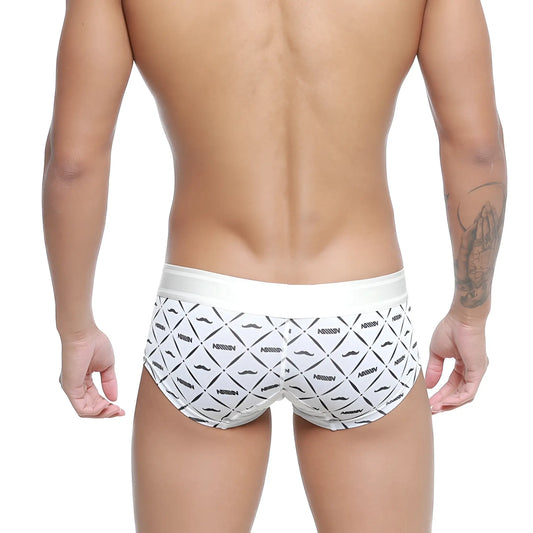 White briefs metro malewear micro mini boxer with black geometric mustache pattern and nassim branding 7013-04