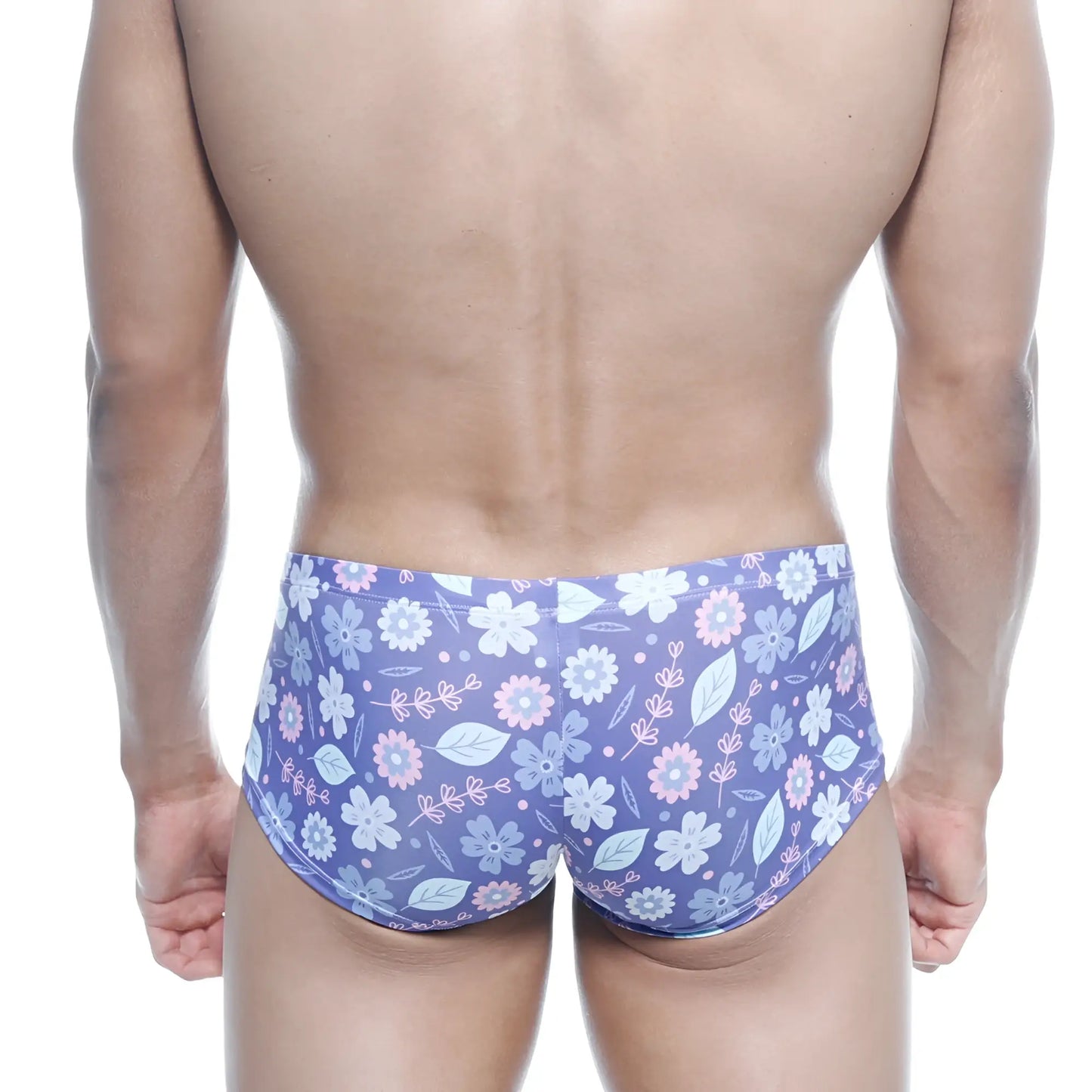 Purple floral swim trunks with light pink and white blossoms and green leaves on soft stretchy fabric by MetroMaleWear