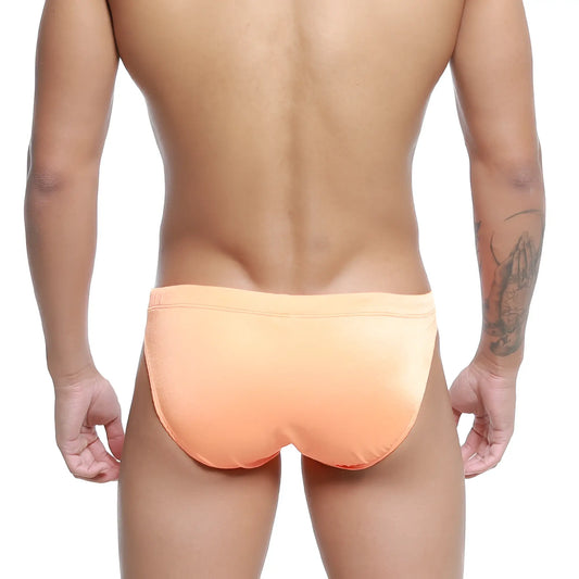 Metro male wear vanguard swim bikini neon orange sleek peach-colored swim trunks with smooth fabric and snug waistband