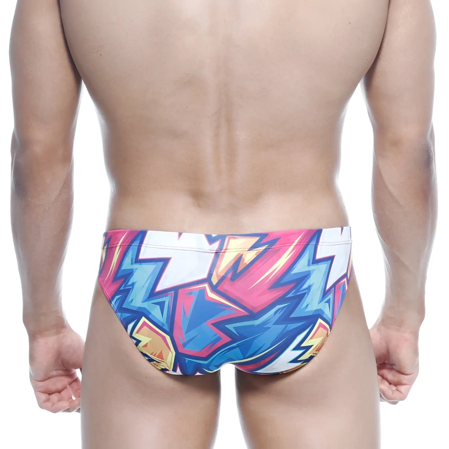 MetroMalewear Vasco hip brief swim trunks with vibrant pink blue and yellow lightning bolt graffiti pattern on white base