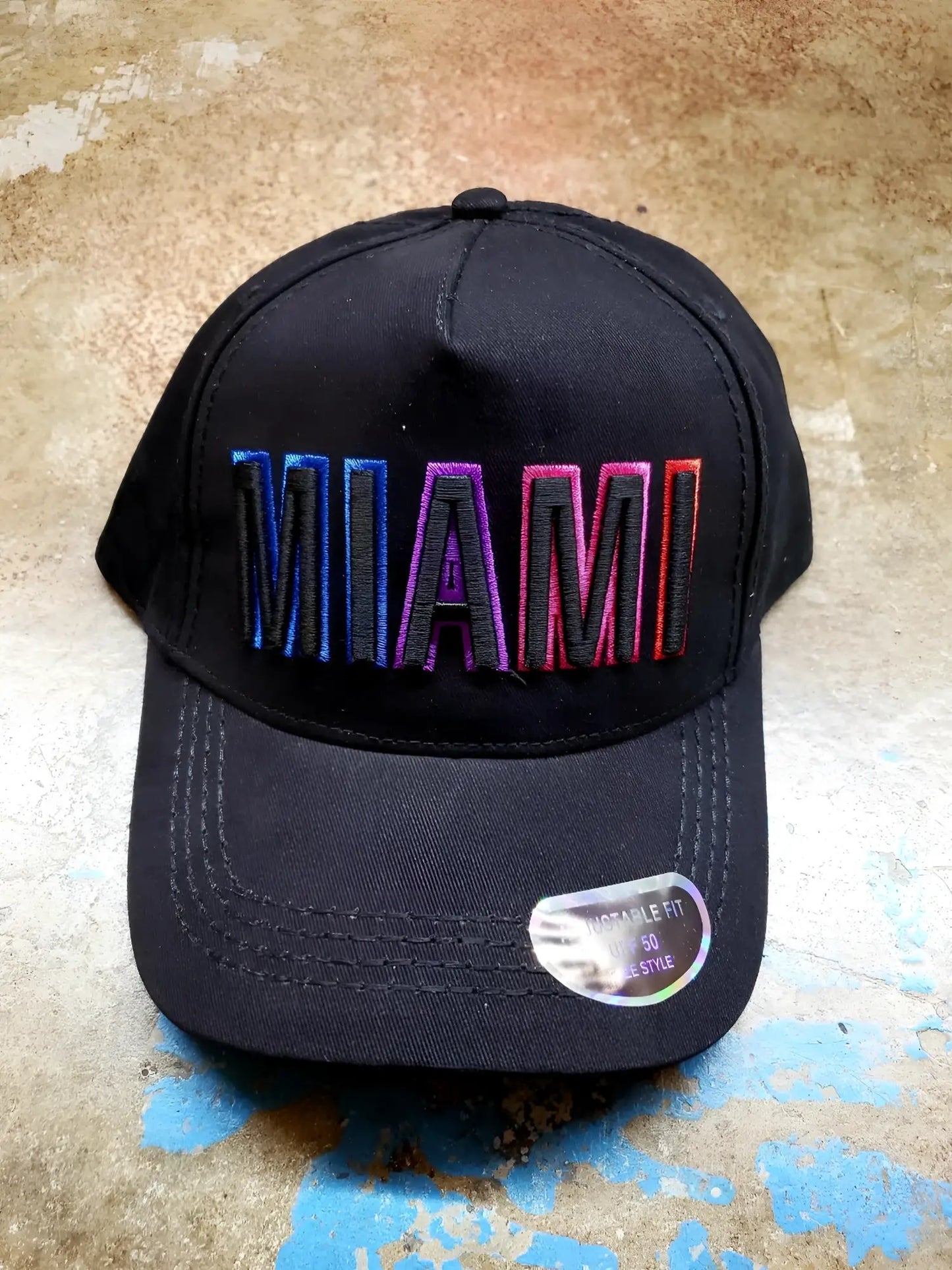 Black miami baseball cap with gradient rainbow embroidered logo on front ideal for casual wear