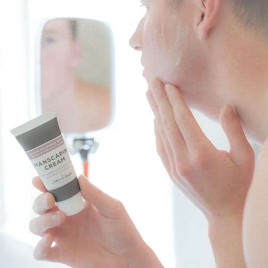 A sleek matte gray tube of vichy cologne manscaping cream shave lotion sent iv with a white cap and minimalist label