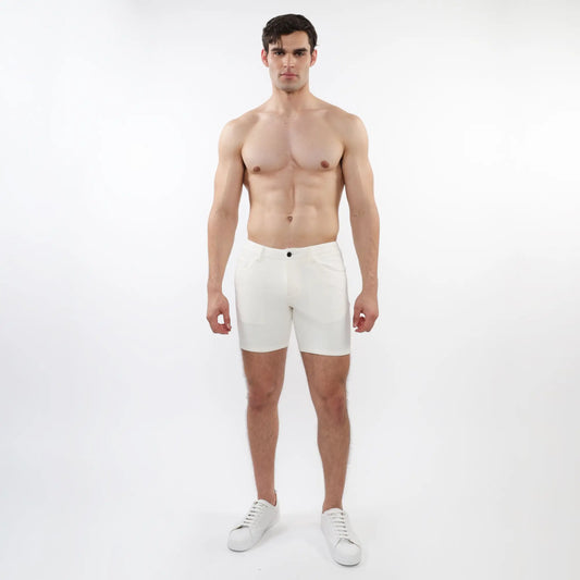 White parquet jacquard stretch knit athletic shorts with sleek minimalist design and single black button waistband