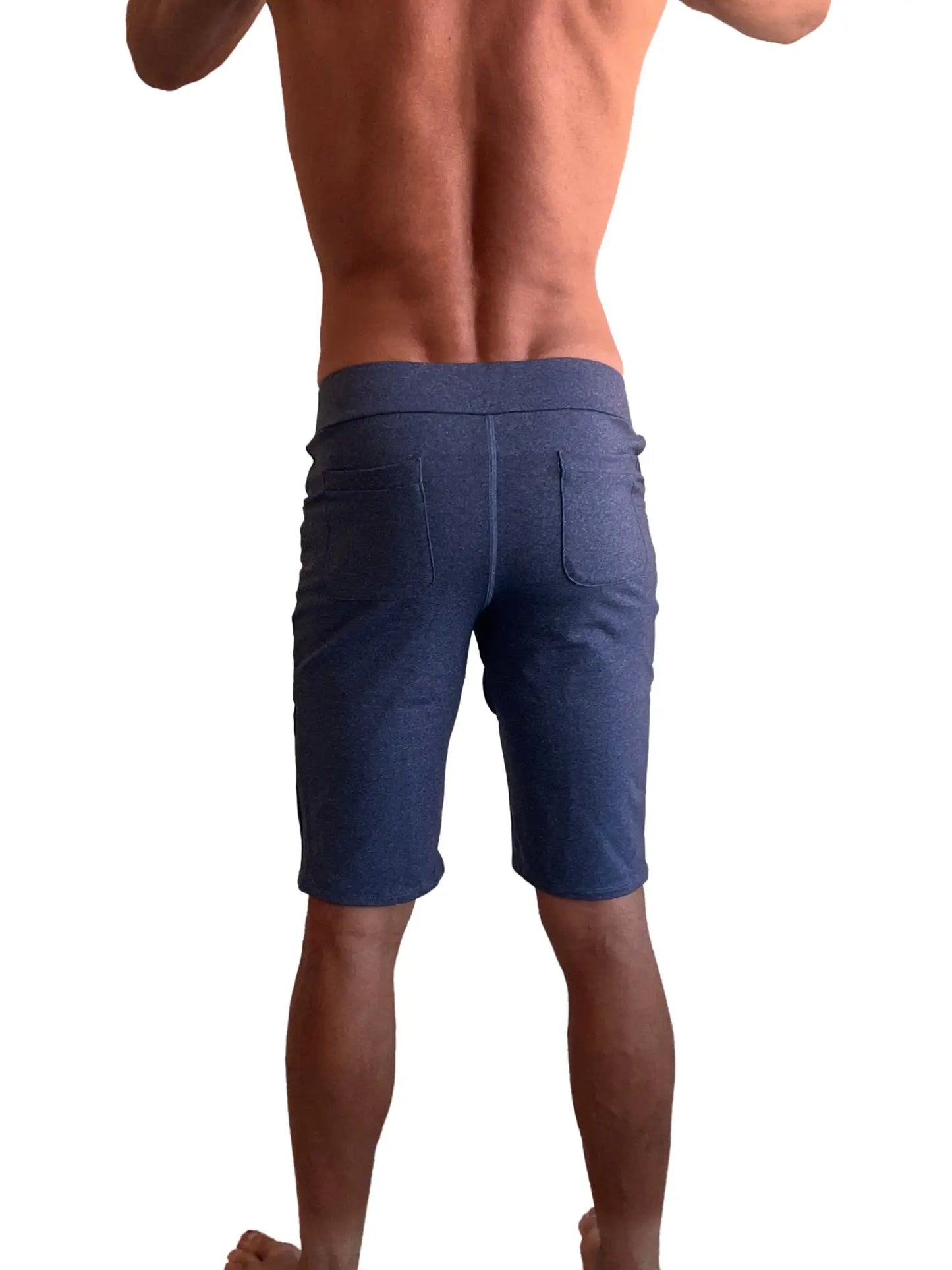 Back view of performance premium urban tactical dress shorts in navy blue heather denim with elastic waistband and two pockets
